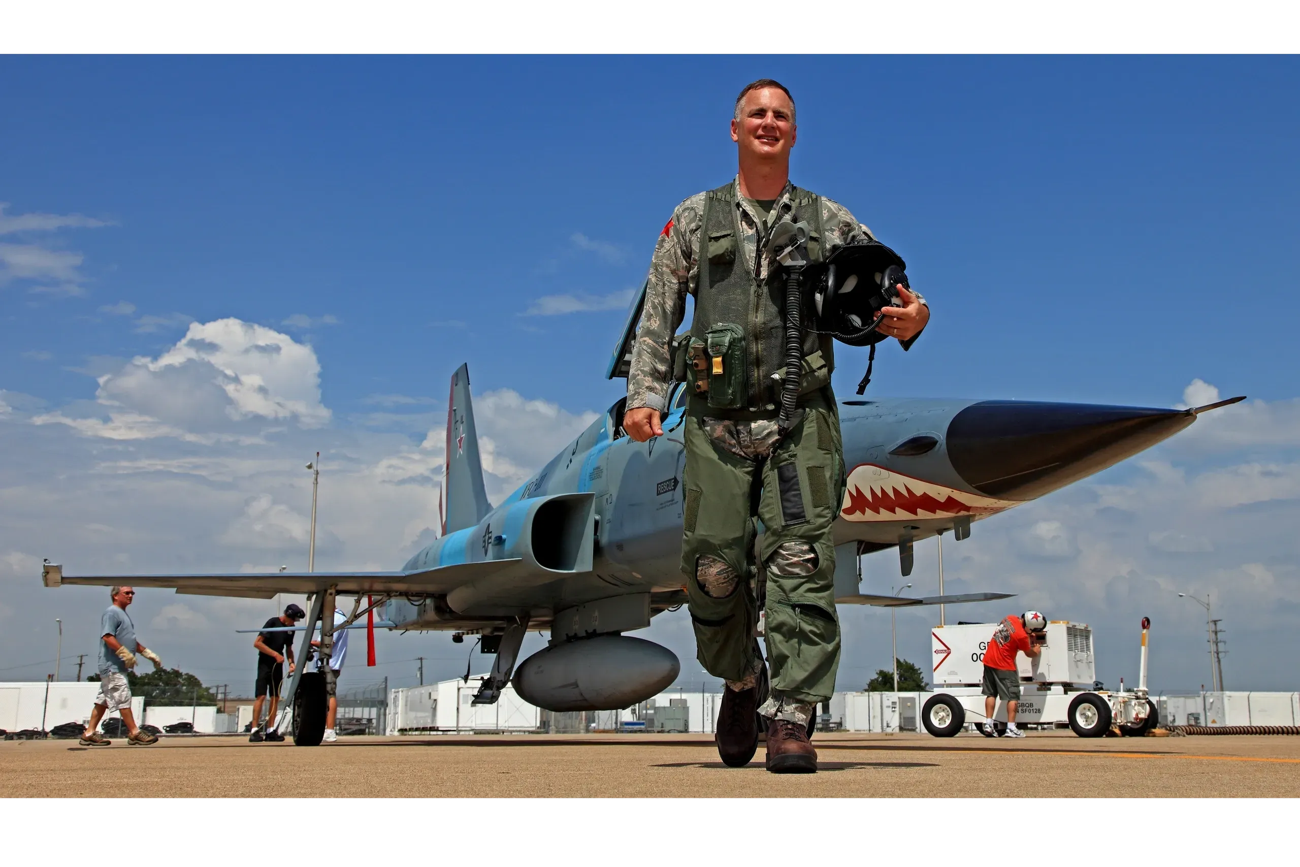 Bag Hefti standing near a Navy fighter aircraft during his career as a Naval Aviator
