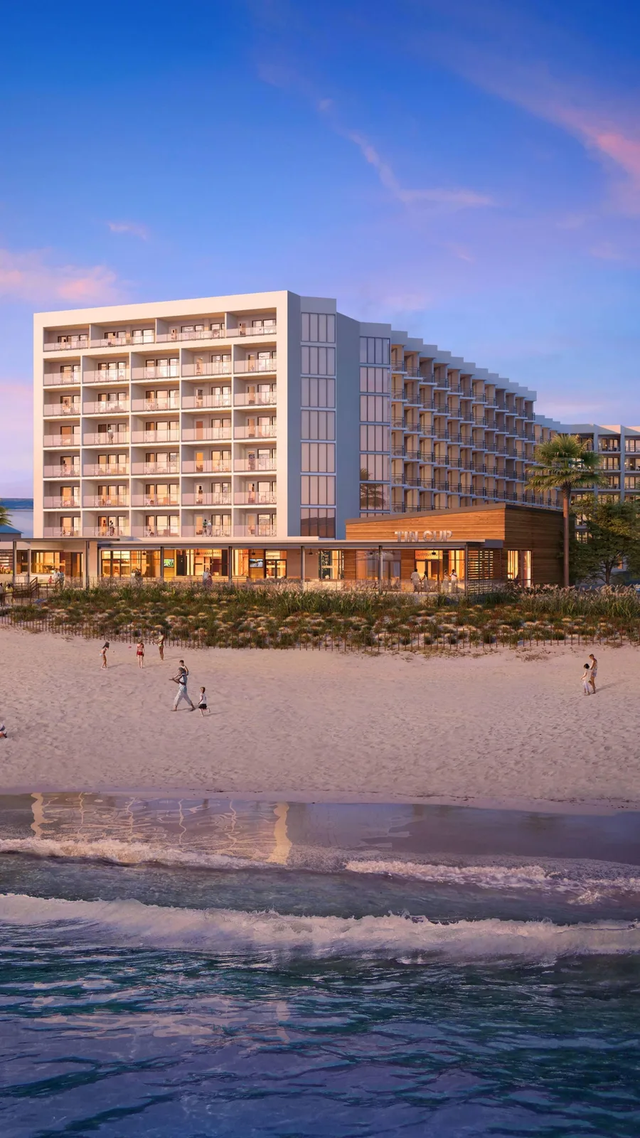 Delta Hotels Virginia Beach Waterfront Suites on the oceanfront at dusk